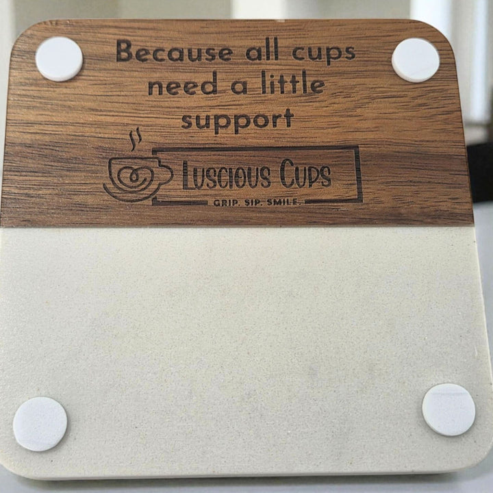 Wood and faux marble coaster with 'Luscious Cups' branding and text saying "Because all cups need a little support"