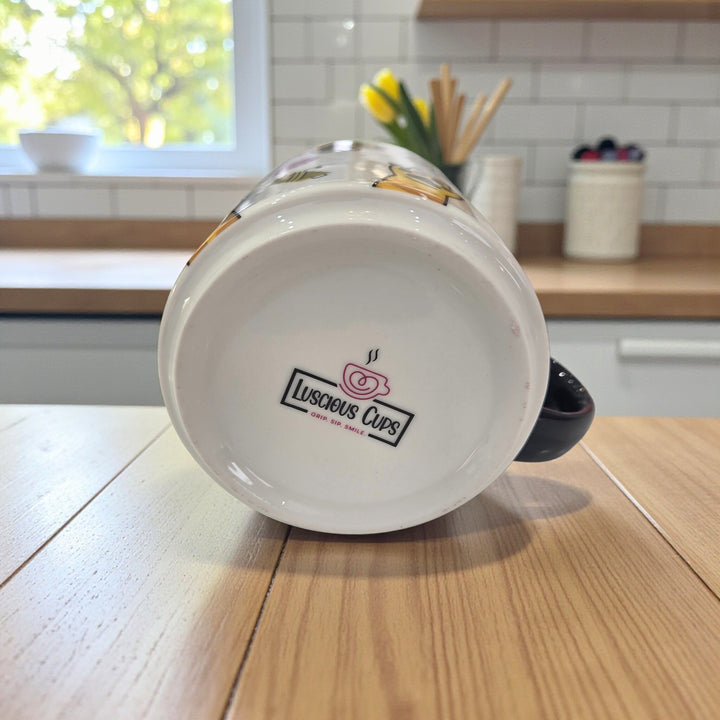 Mug with 'Luscious Cups' logo on a wooden table in a kitchen setting