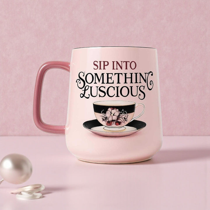 Pink mug with 'Sip into Somethin' Luscious' text and tea cup design on a pink background
